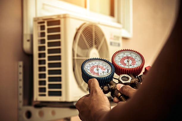 Professional Air Conditioning Service technician working in Alton, IL